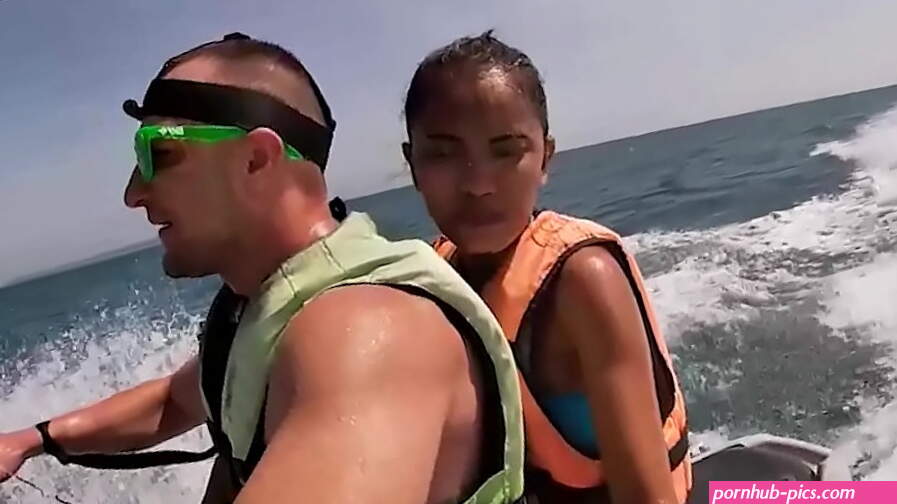 Pretty asian wife gives a blowjob on a jetski