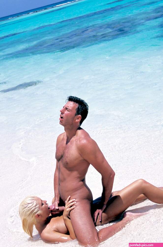 Blonde blowjob by the sea