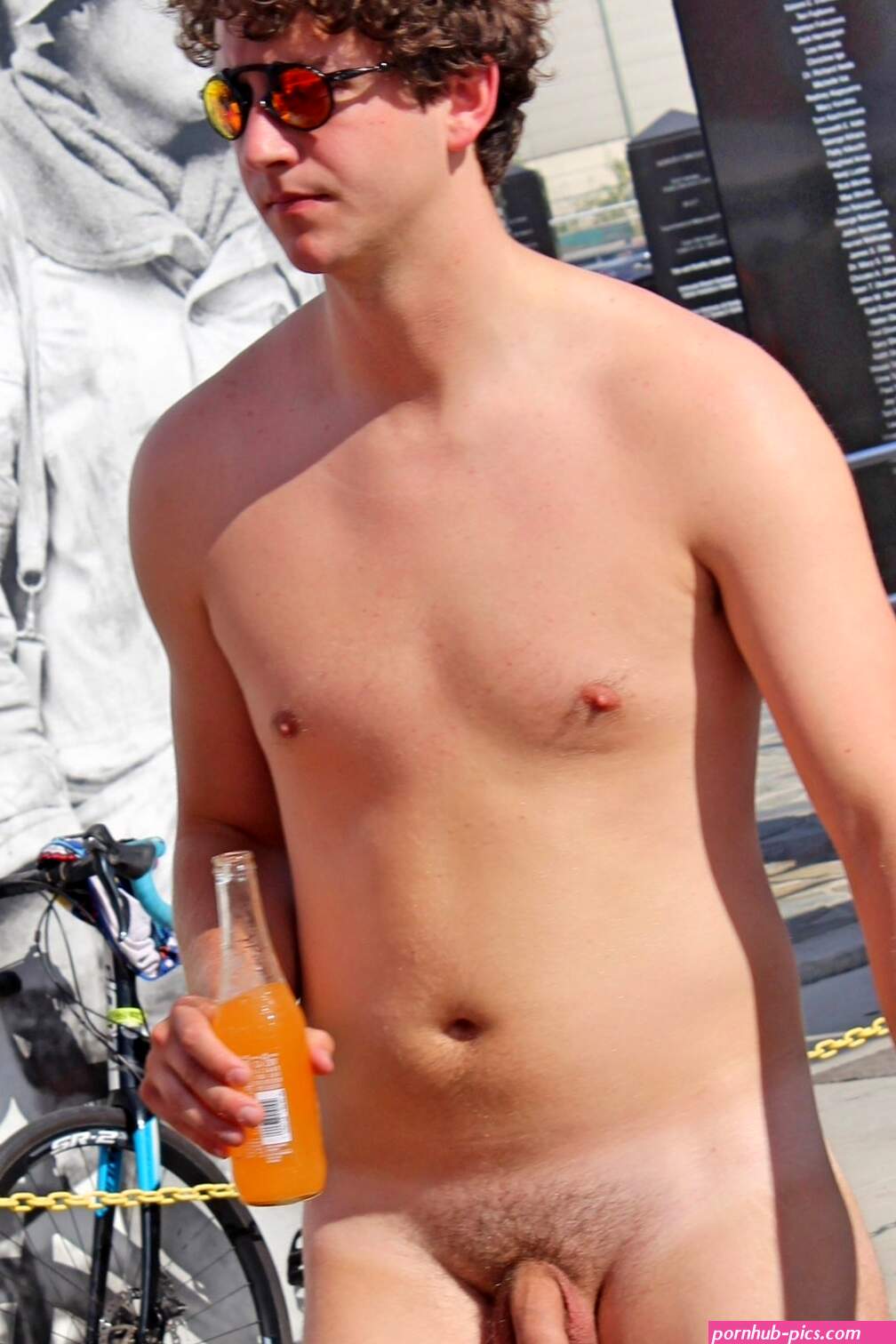 Nude guy with curly hair