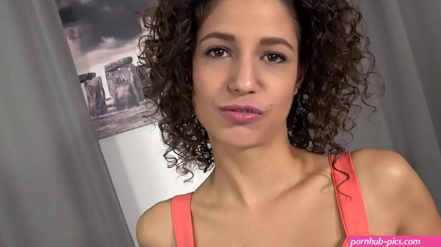 Curly-haired petite rubs her pussy and fucks a big thick dildo