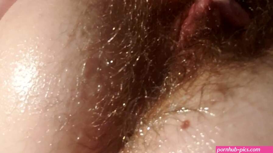 Oiled up girl fingers asshole and plays with big clit