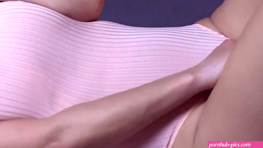Anna Azerli behind a sheer curtain