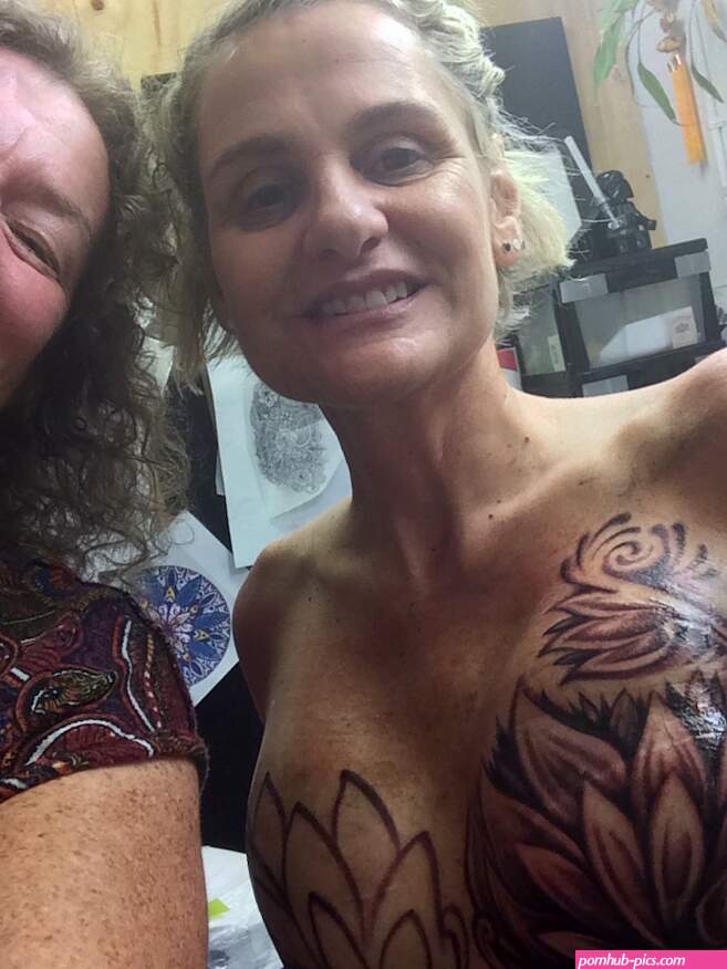 Behind the breast tattoos: Darwin breast cancer survivor says response to her double mastectomy art quite intimidating but wonderful
