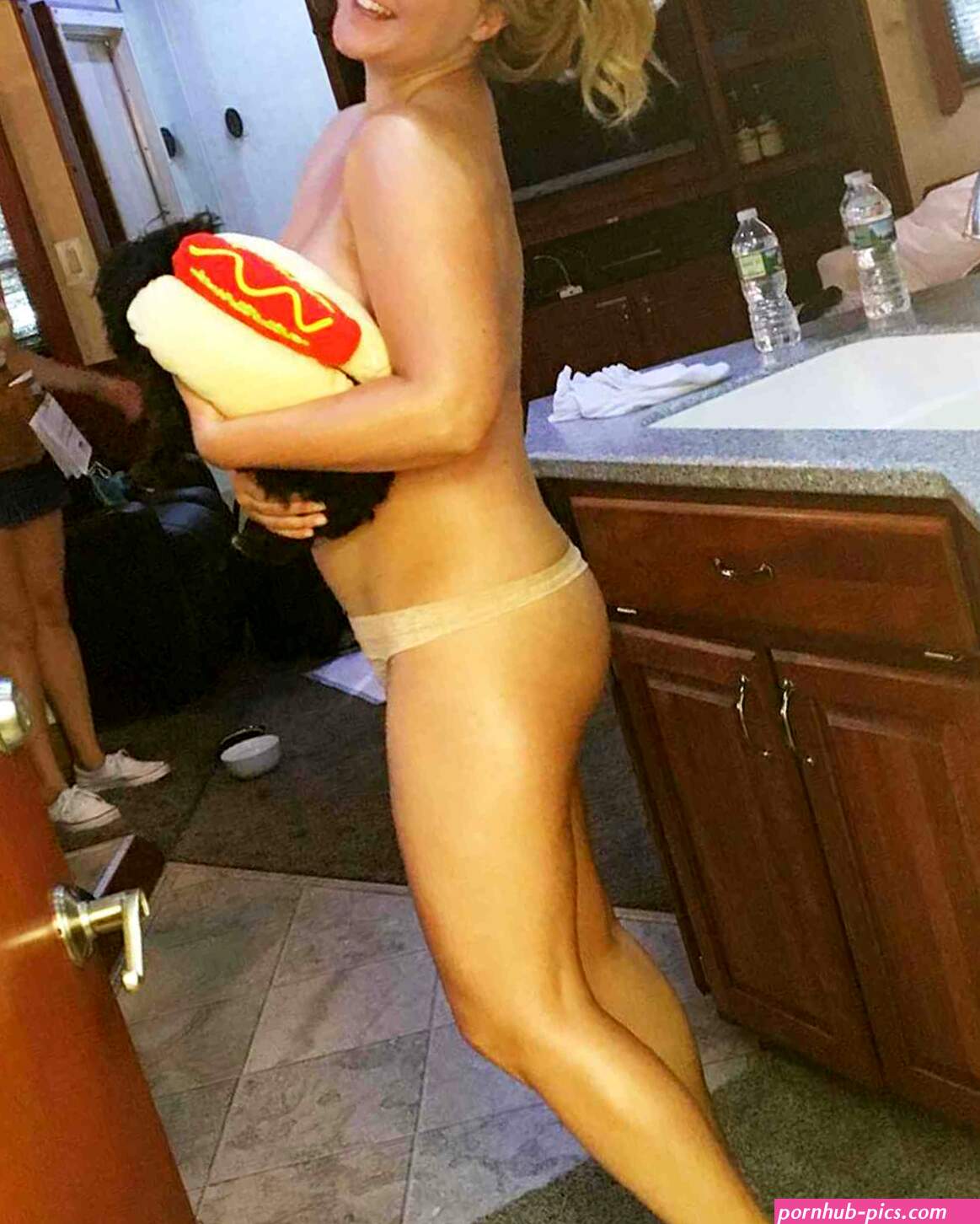 Amy Schumer Poses Nearly Nude While Holding a Hot Dog Dog