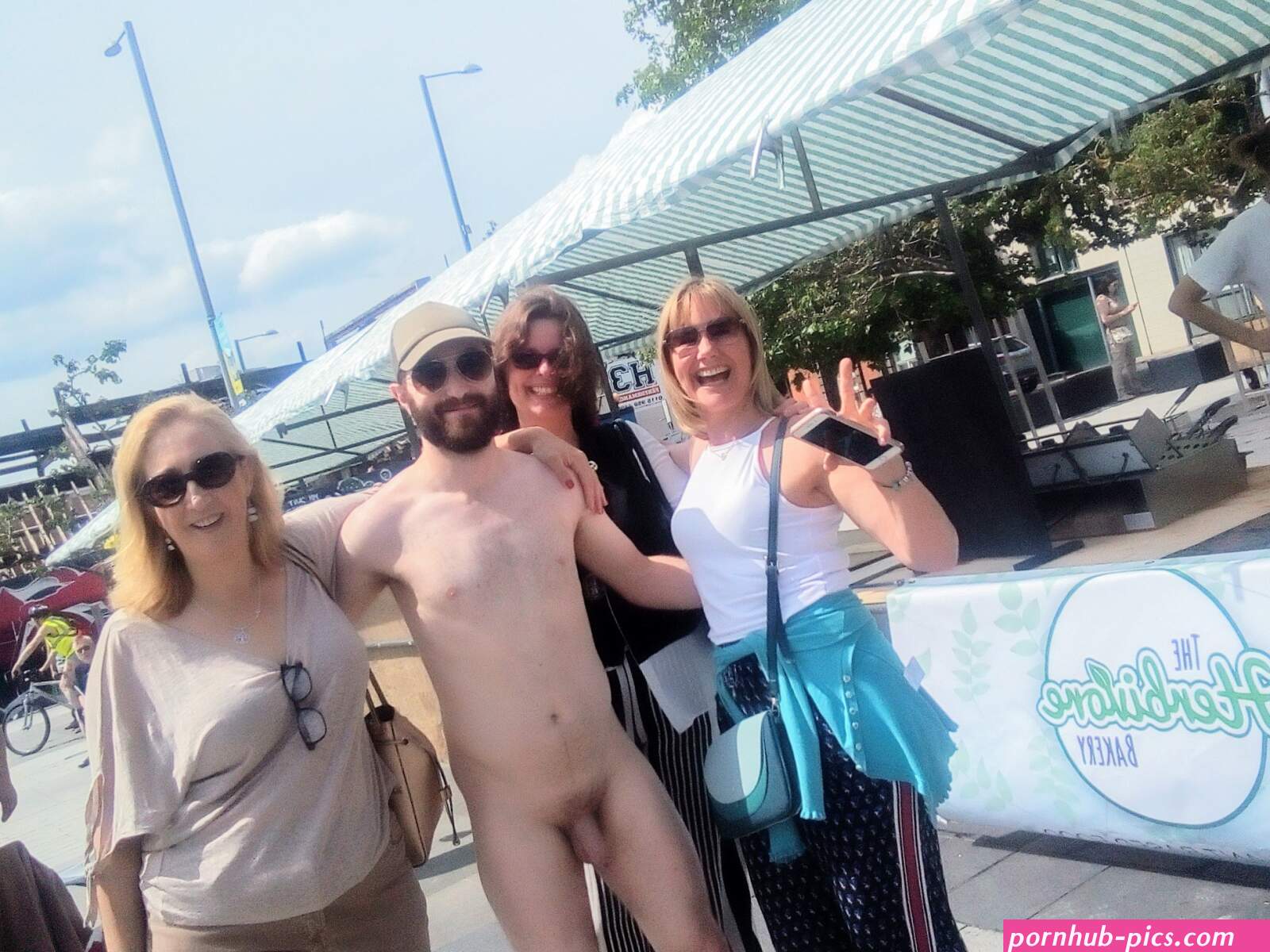 File:Nude in public with women.jpg