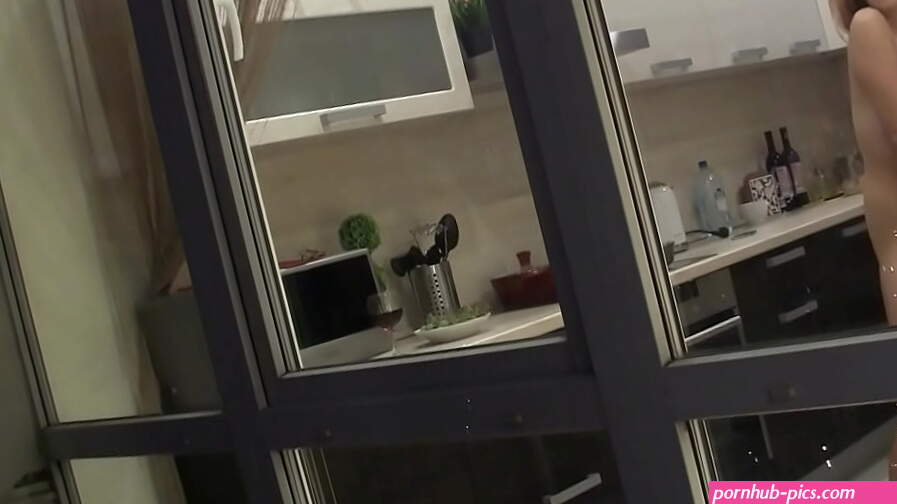 Watching my neighbours naked sexy girlfriend goofing around in the kitchen