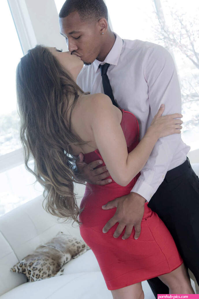 Dress-wearing brunette in red gets fucked by a massive black cock