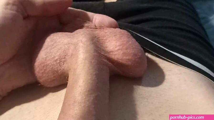 Teen is playing with his balls