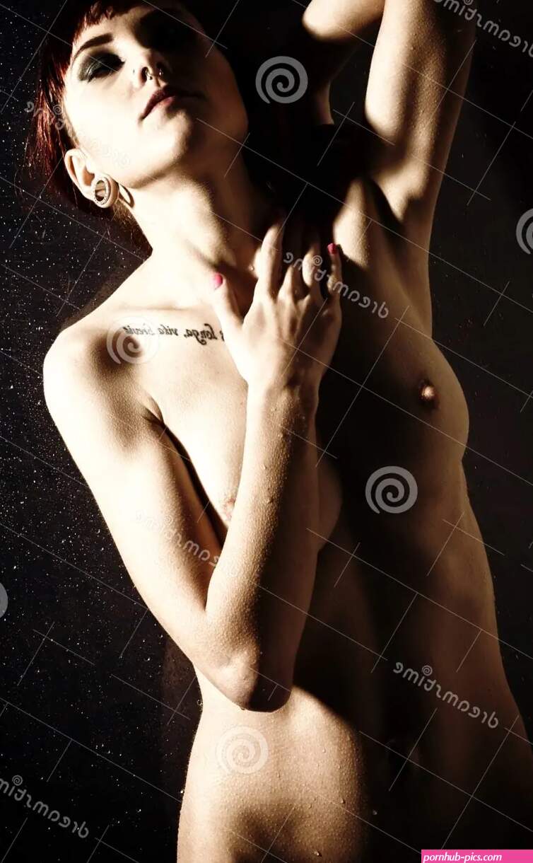 Graceful Naked Young Woman with Big Boobs and Water Droplets on a Body on a Dark Background Stock Image