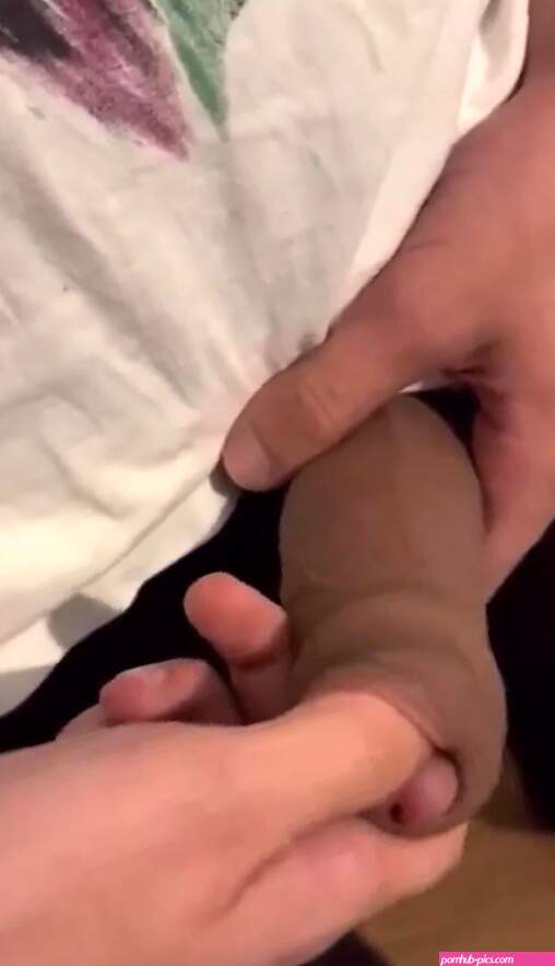 Fingering the nice foreskin of his big brown uncut cock
