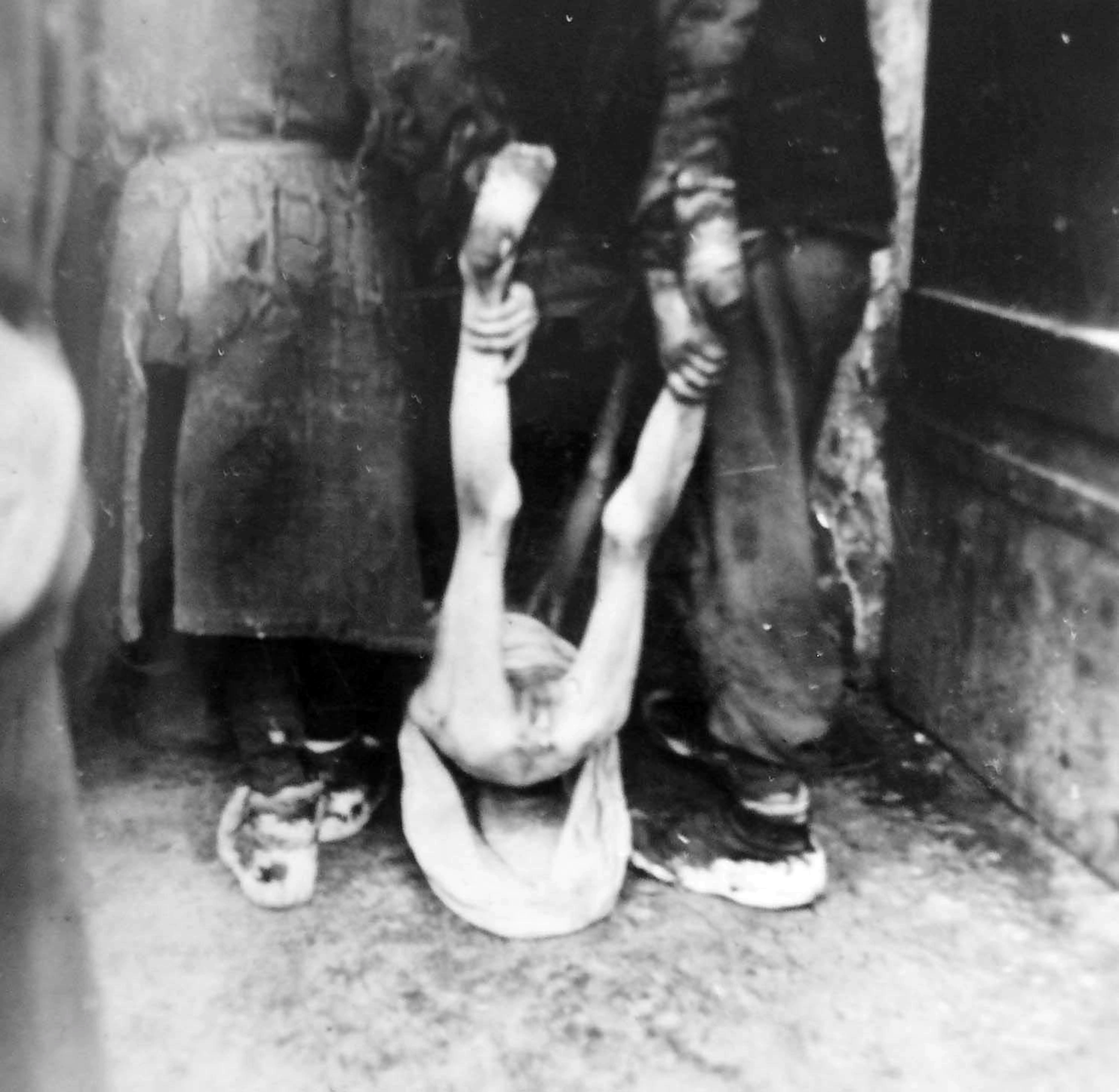 Naked Soviet POWs in a POW camp with a German guard.