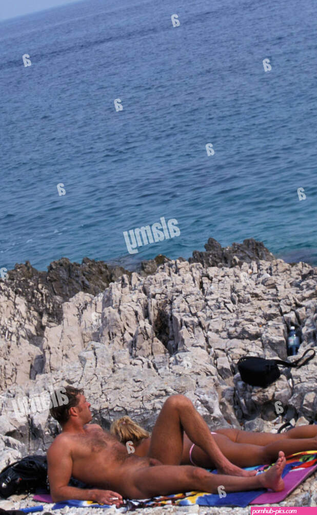 Naked couple sunbathing at beach near Veli Rat Dugi Otok island Dalmatia Croatia Stock Photo