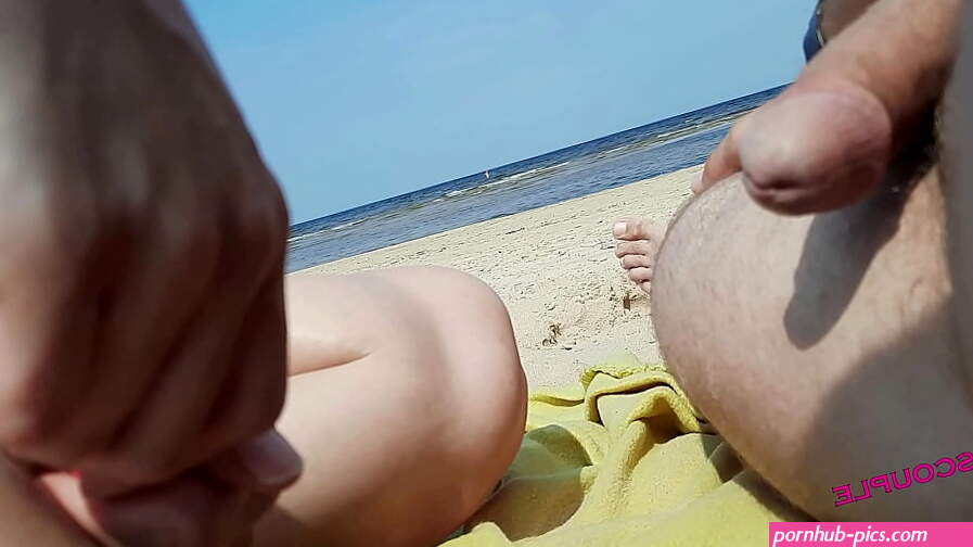 on a nude beach a couple indulges in debauchery