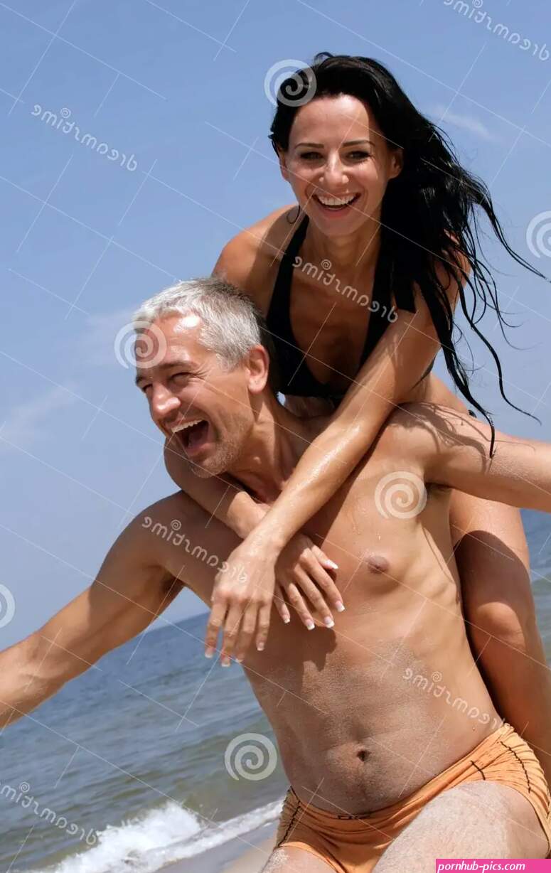 Couple Having Fun on the Beach Stock Photo