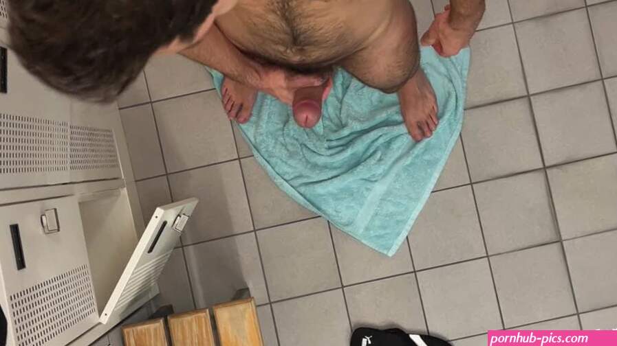 Locker room masturbation while other men taking a shower and changing