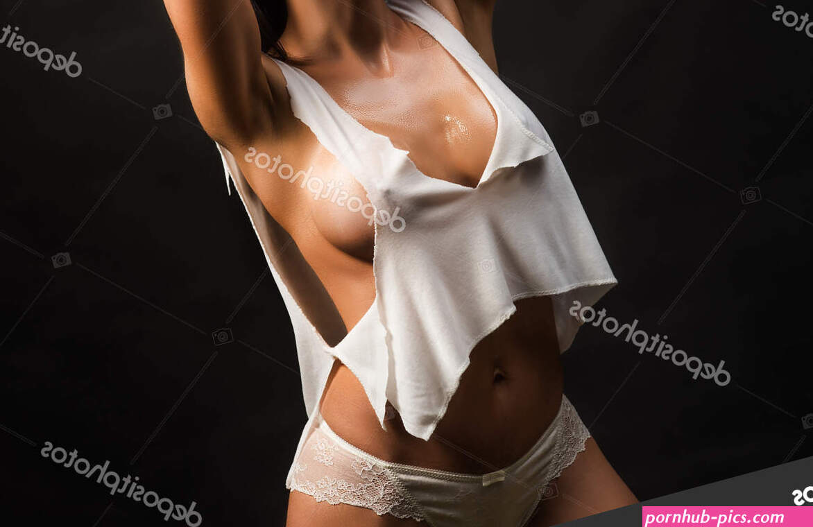 Beauty of womans body. Wet with water sensual young girl with slim fit figure and natural big bust. Attractive sexy woman wearing white underwear. Natural big boobs concept. Stock Photo