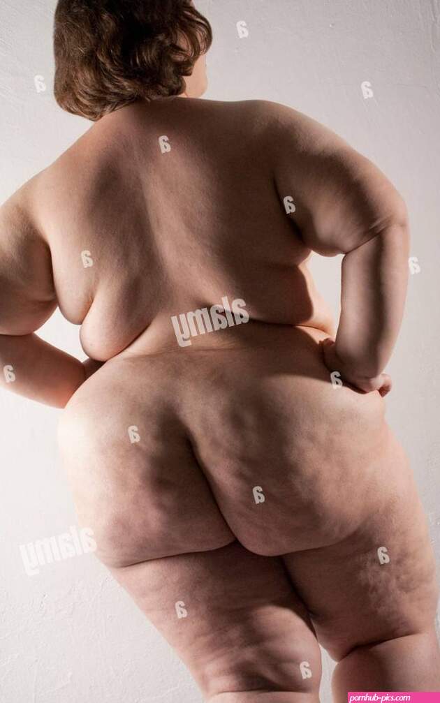Overweight nude woman rear view Stock Photo