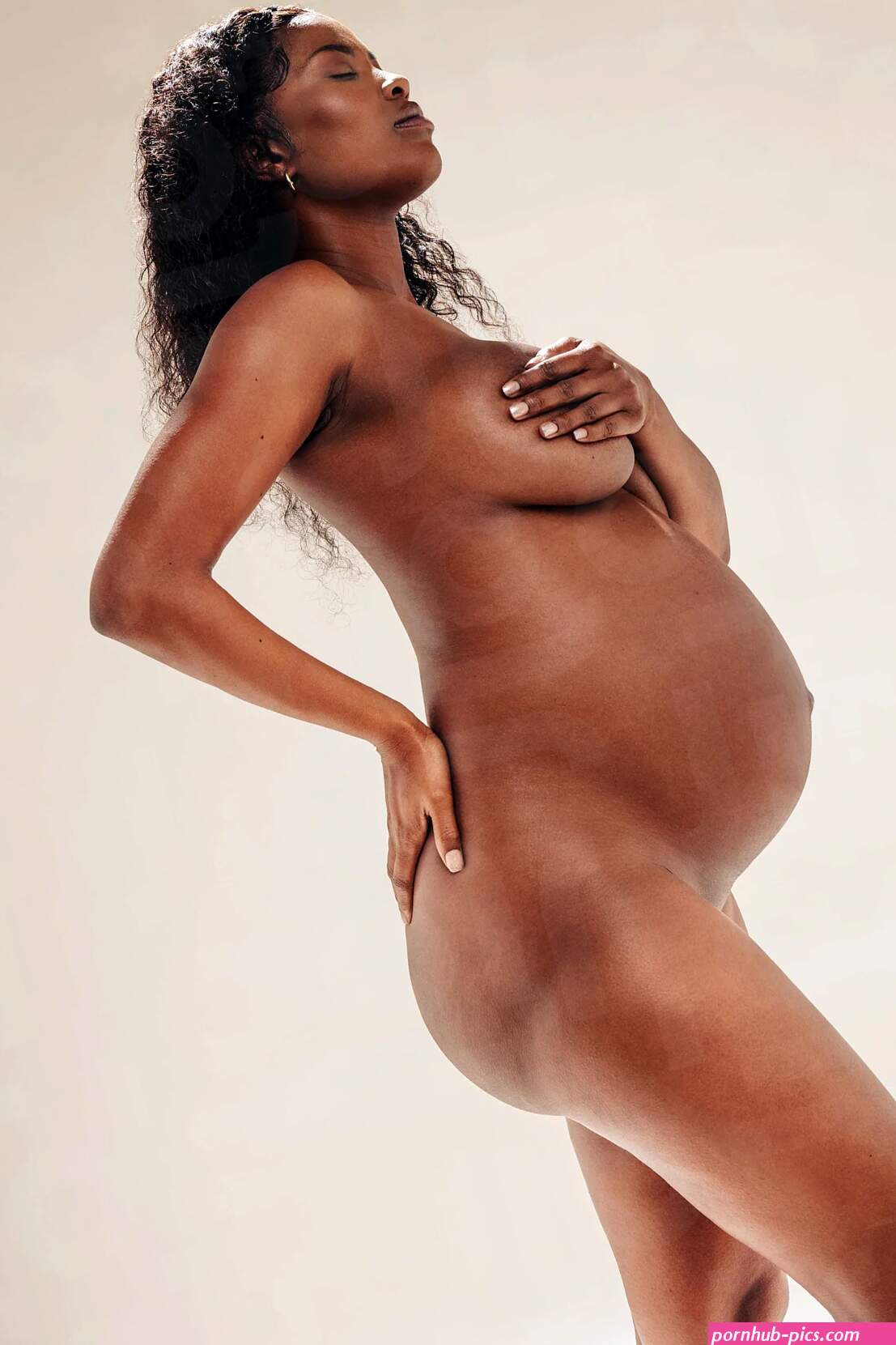 Antenatal body positivity: Pregnant black woman showing her naked body