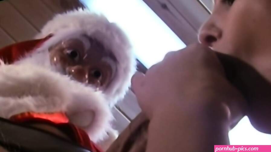 Nicole Gives Santa a Blowjob