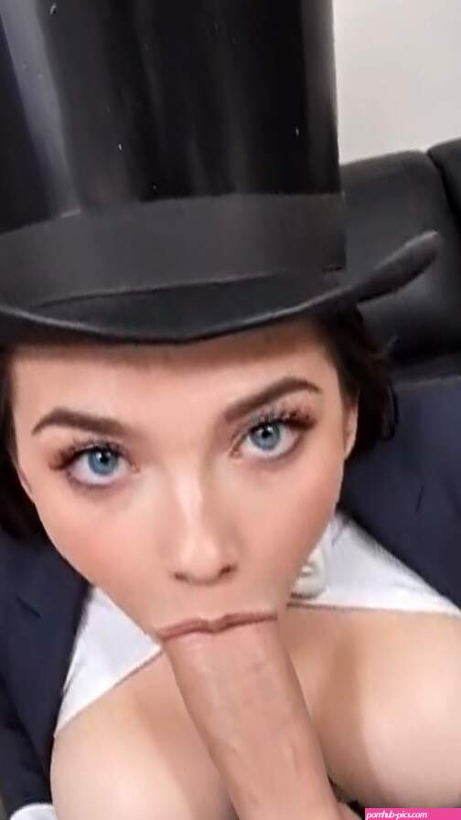 Top Hat Brunette Deepthroats Thick Cock in Formal Suit During AI Blowjob Video