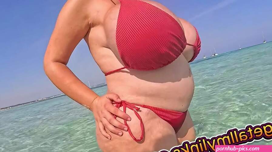 Pregnant Bimbo With Massive Implants Teases Her Unreal Beach Body in Public