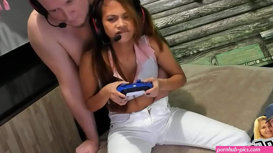 Fingering her tight pussy while she plays video games then oil through pants with squirt show and cumm shot end