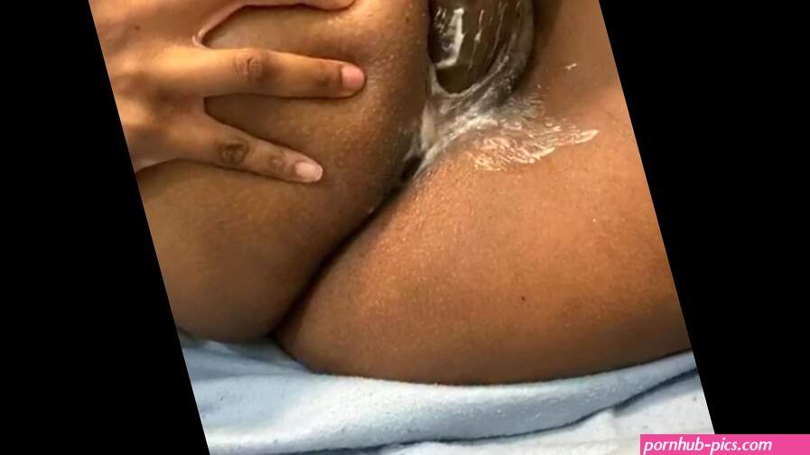 Mia Black plays with her hairy creamy Black pussy