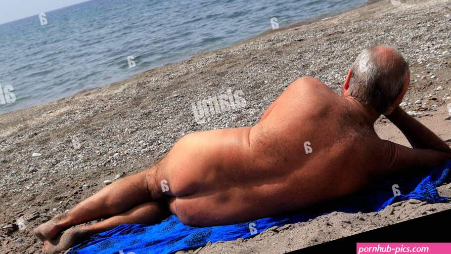 Naked man on Greek beach Dodecanese Islands Greece. Taken My 2024 Stock Photo