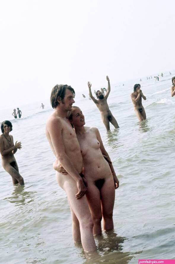 Isle of Wight Festival. A young couple posing naked in the sea