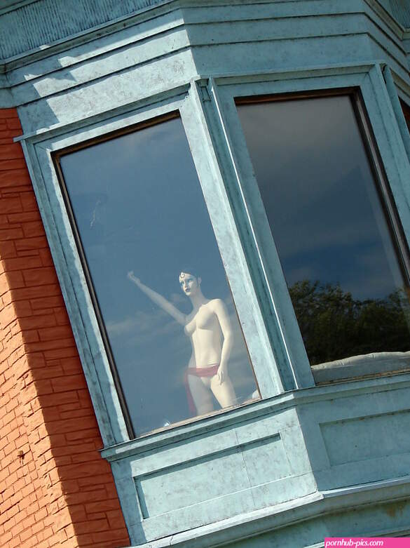 nude in a window