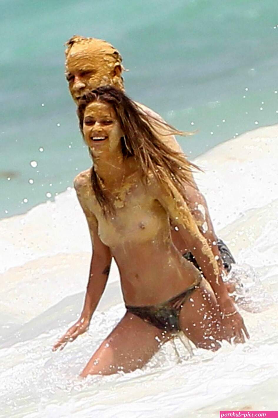 Niamh Adkins topless in a water