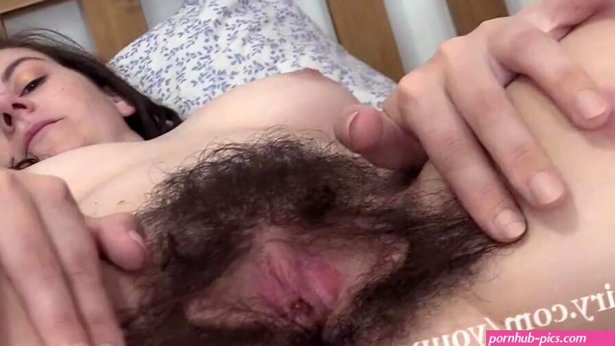 Effy shows off her very hairy pussy in bed