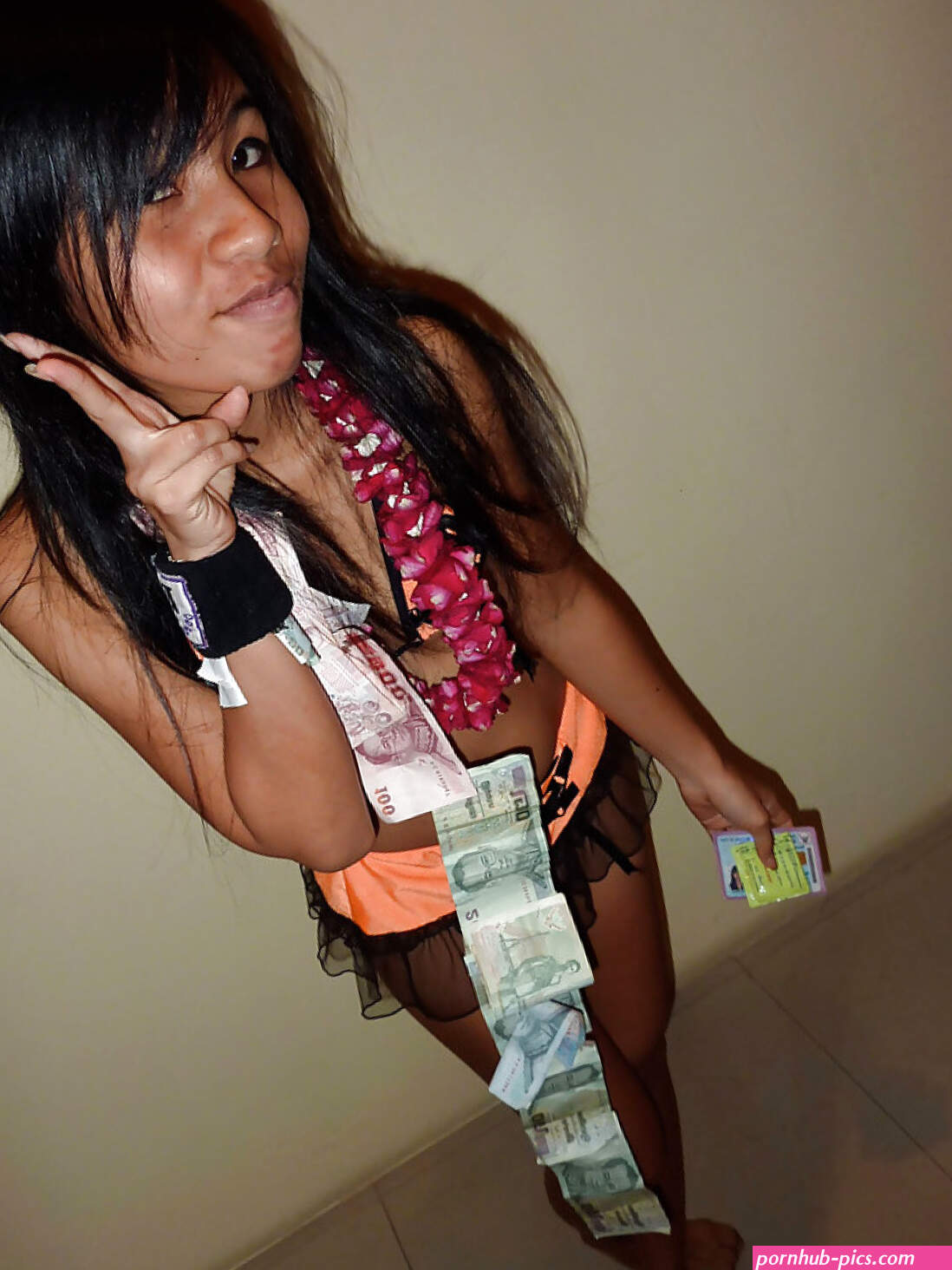 Petite Thai bar girl showing off her shaved pussy for money