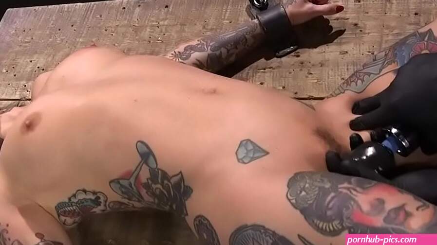 Gagged tattooed brunette slut in device bondage set on pipe with all weight on her pussy then made to cum in grueling bondage