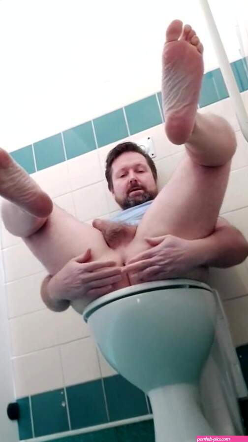 Naked wanking in a public restroom