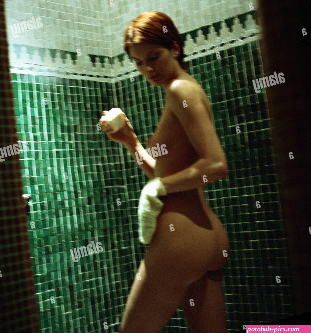 Nude woman with wash glove and soap rear view Stock Photo