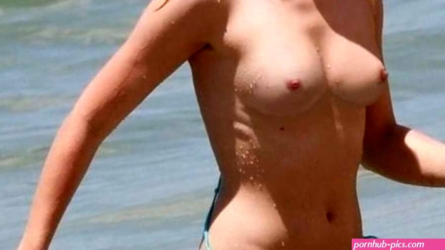 Kristen Bell topless at the beach