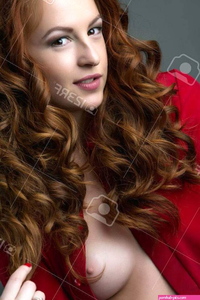 Image Of Flirtatious Redhead Babe Showing Her Bare Breast Stock Photo Picture and Royalty Free Image. Image 56088939.
