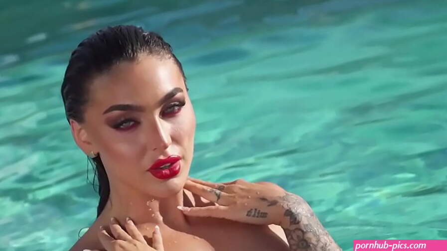 Smoking hot naked brunette babe Emjay Rinaudo is in her element by the pool