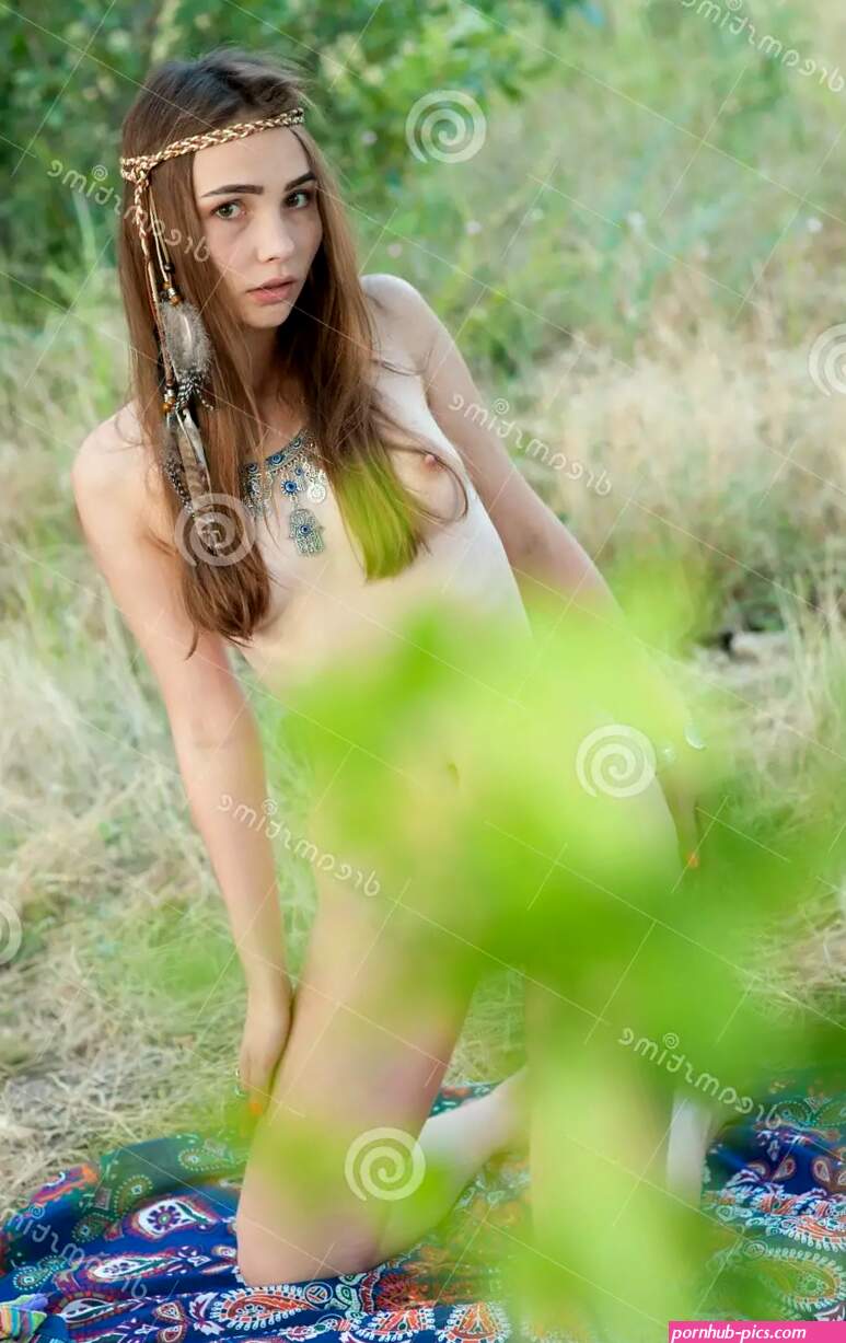 Young Naked Hippie Girl in Boho Chic Jewelry Posing in the Summer Forest Stock Image