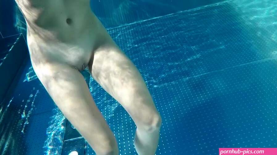 Nude teen with amazing tits in a public pool makes small dick hard