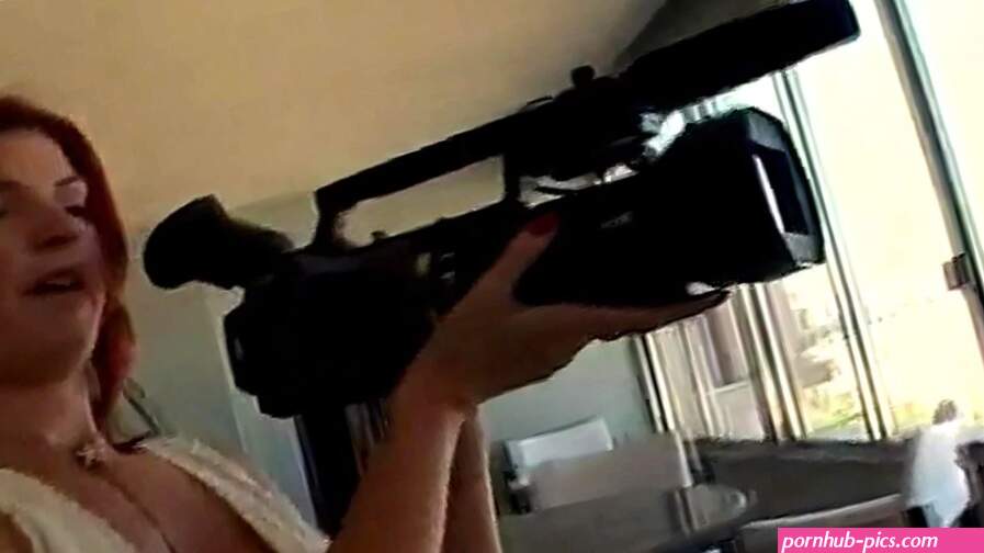 Reluctant redhead camera woman gets pulled into porn set sex