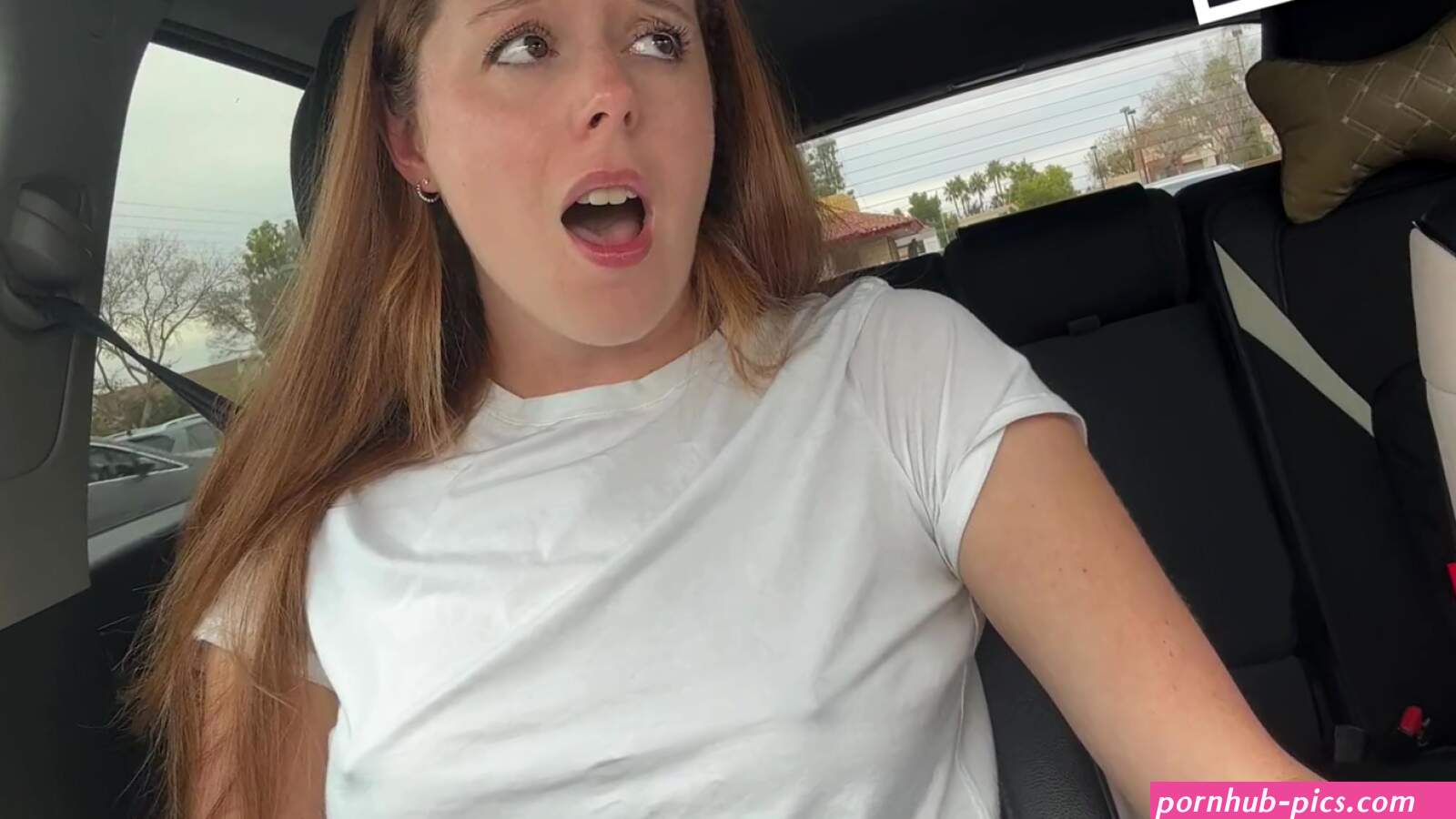 Cute redhead cums from vibrator stimulation in car