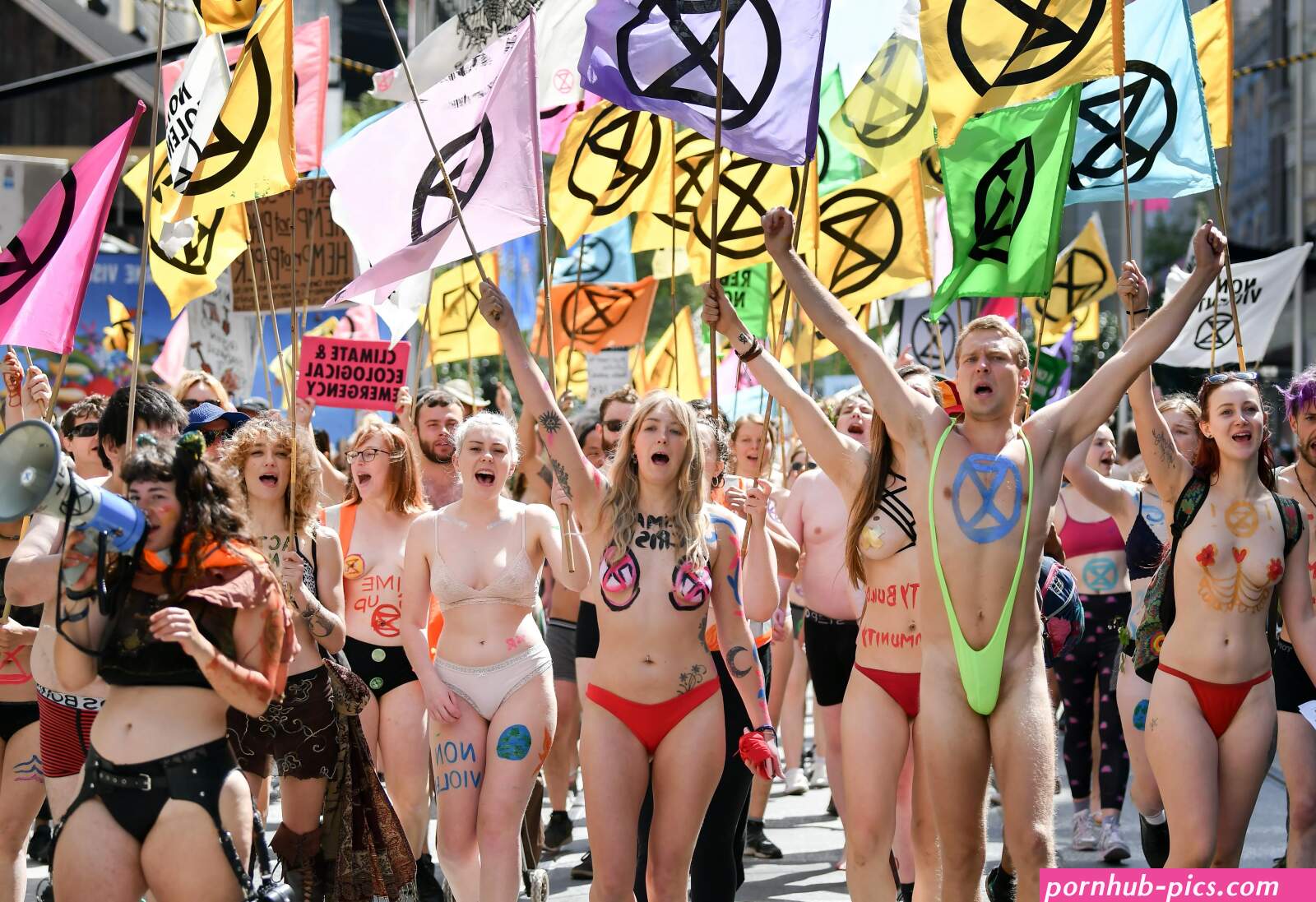 Extinction Rebellion climate change protesters strip off for nudie parade complete with glitter boobs in Australia