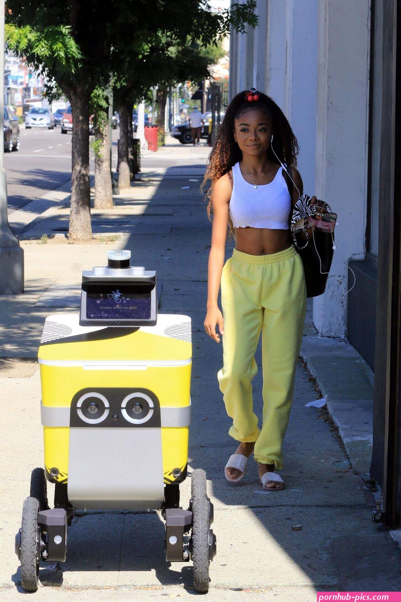 Skai Jackson Walks in With a Matching Postmates Delivery Cart