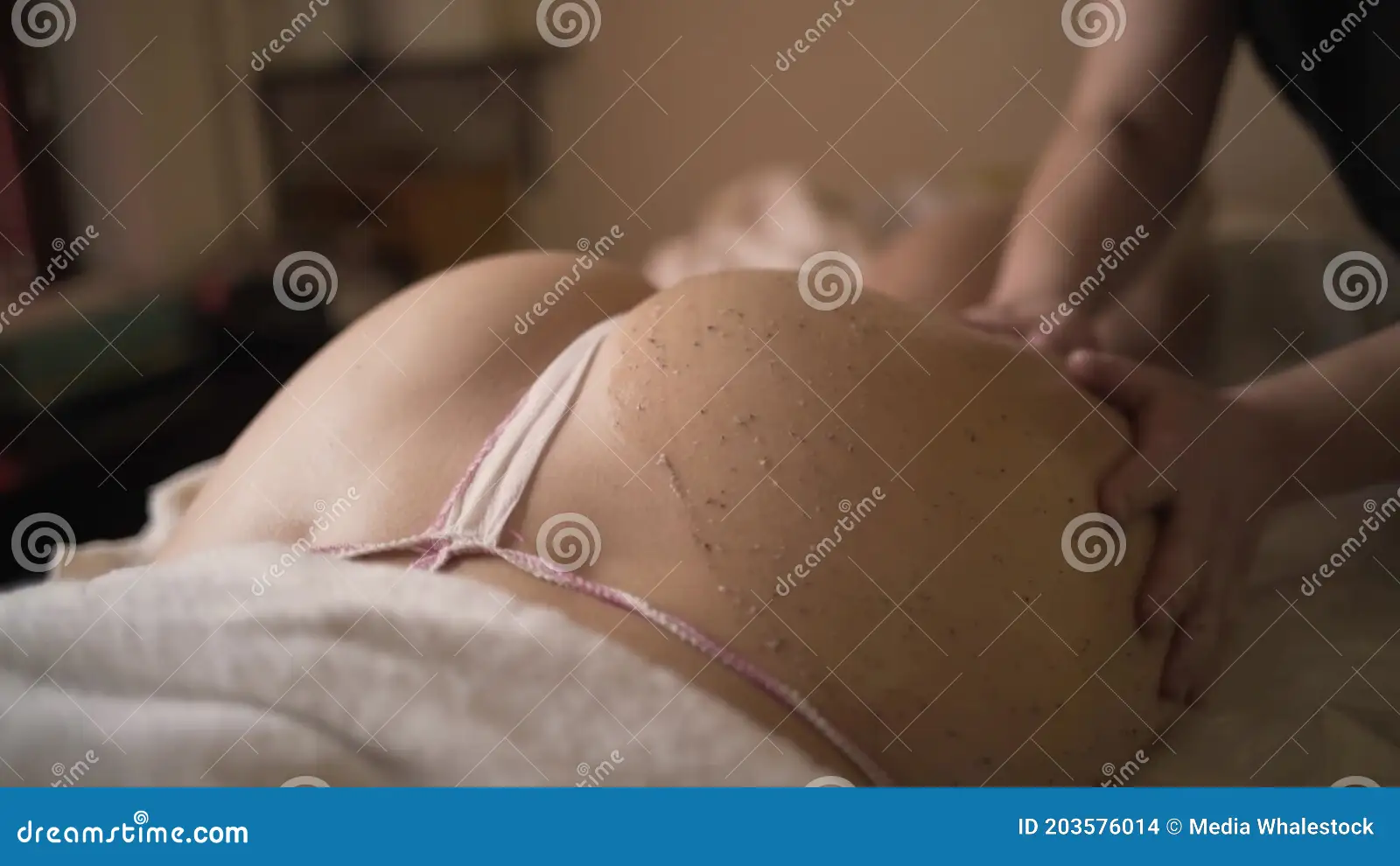 Massage Scrubbing of Buttocks in Spa. Action Stock Footage