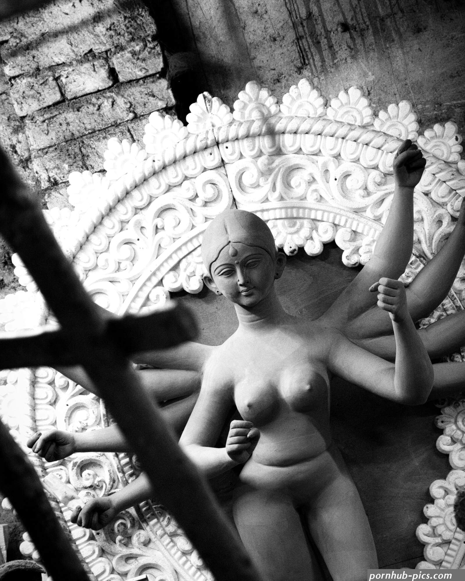 A statue of a naked woman in a room photo