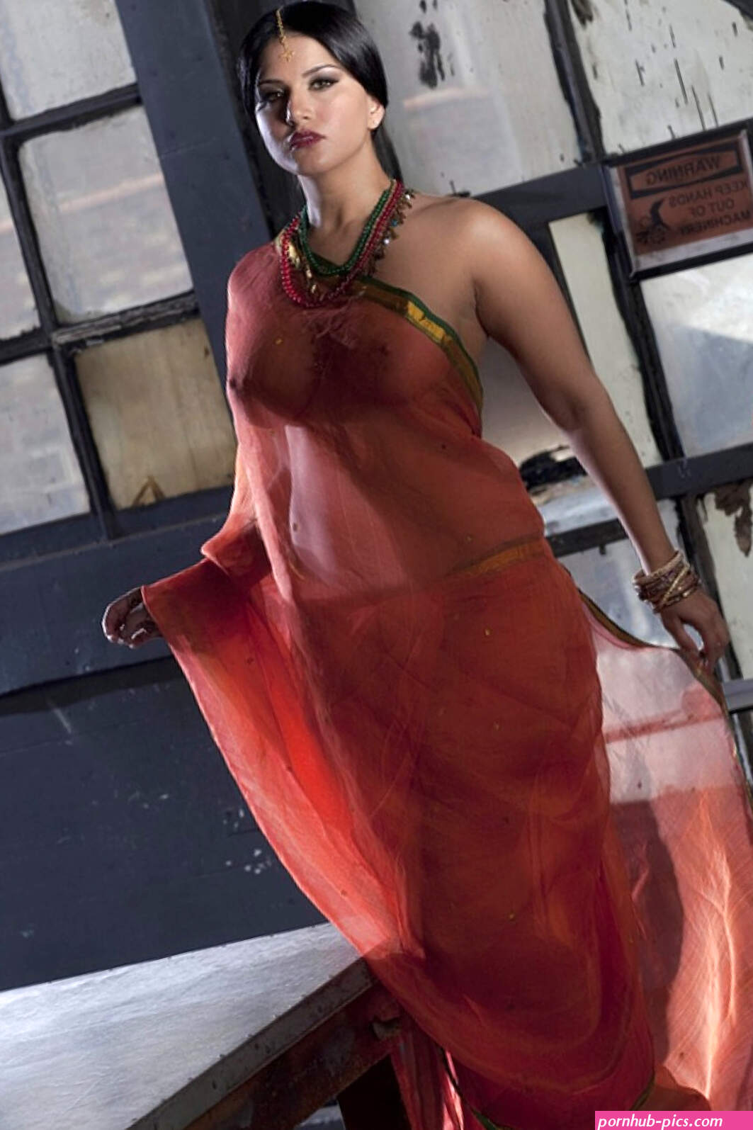 Busty solo girl Sunny Leone models solo in see thru Indian attire
