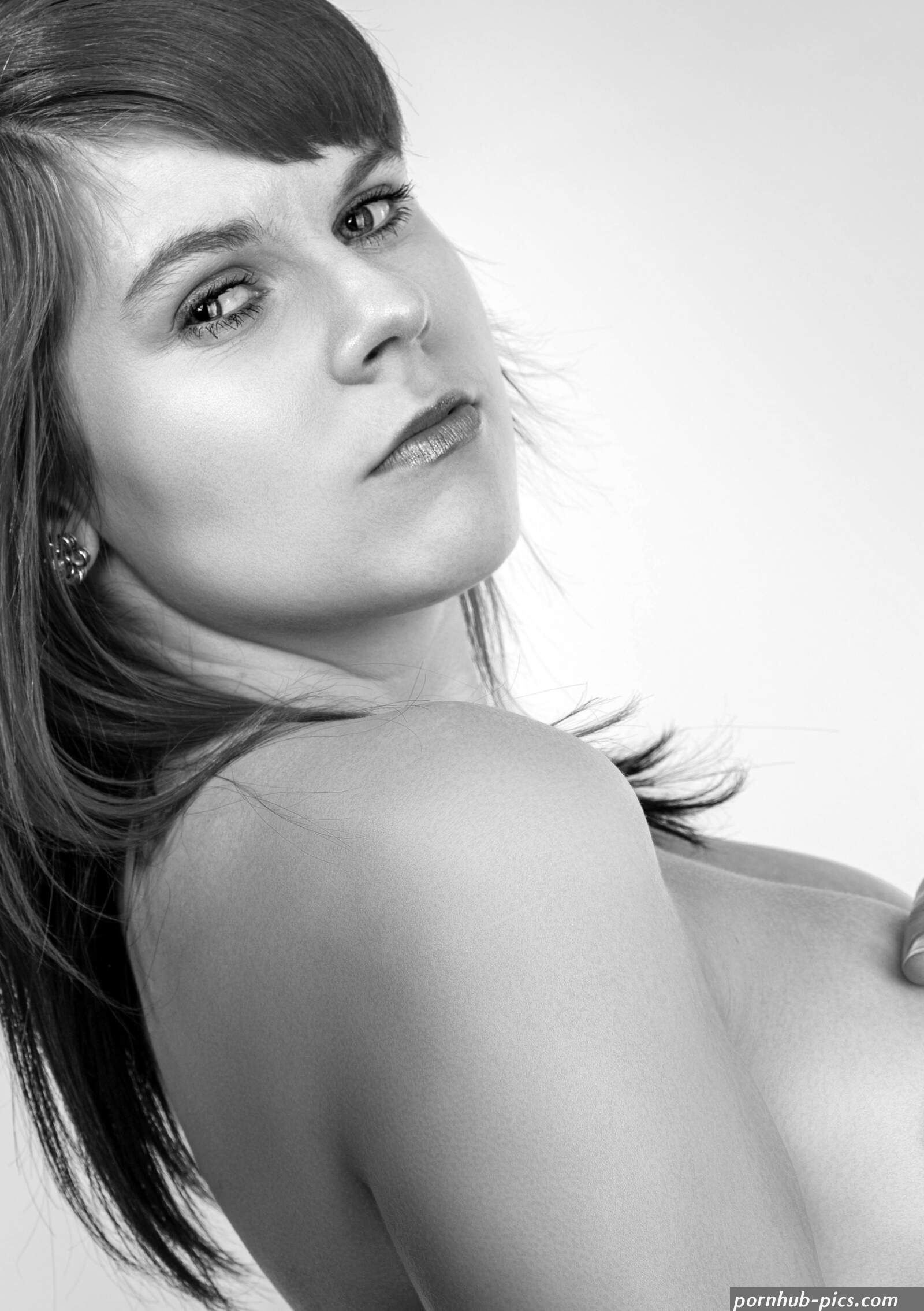 Monochrome Photo of a Naked Woman Looking at the Camera Free Stock Photo